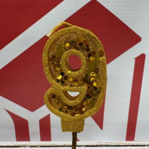 VELA NUMERO 9 GIBREADA CON PALITO 20 CM DORADO IMP